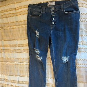 Free people blue jeans with drestress at the bottom, rips in the legs size 31